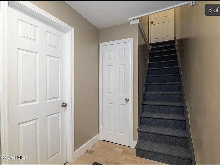 Stairs on right side leading to apartment.