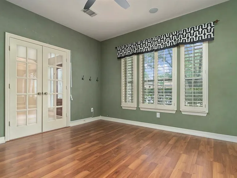 Dance studio. Wall opposite of door is all mirror. Studio is currently pink, but can be painted.