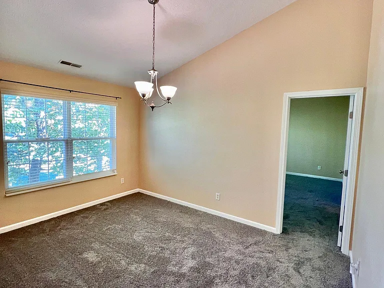 dining room overlooking the back wooded area.