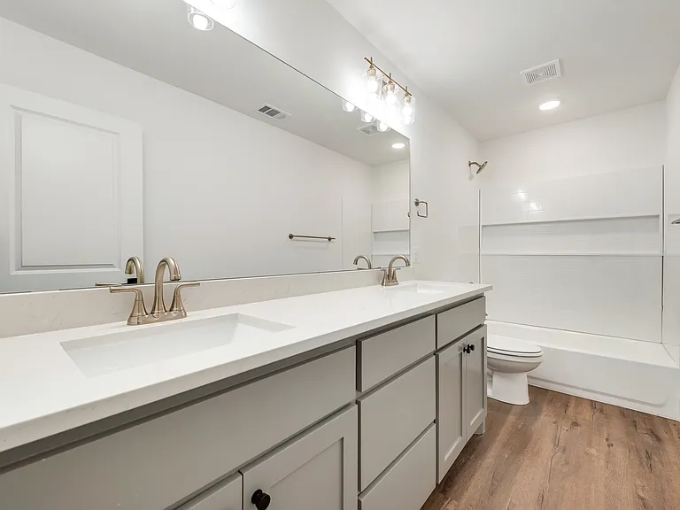 Primary bathroom with two sinks.