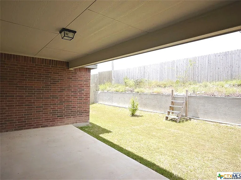 Part of the backyard covered patio.