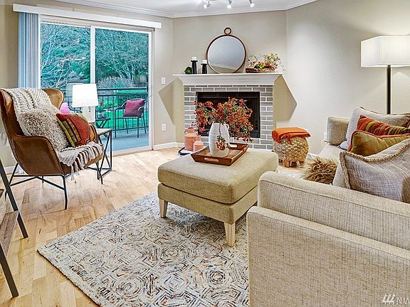 Elegant living room opens to rear slider, leading to your private patio