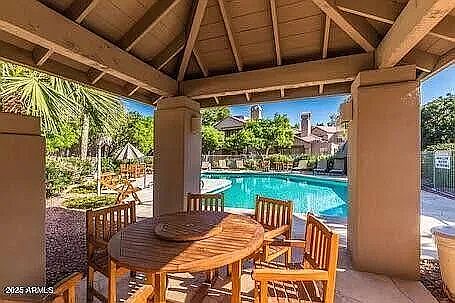 Seating area adjacent to complex pool.