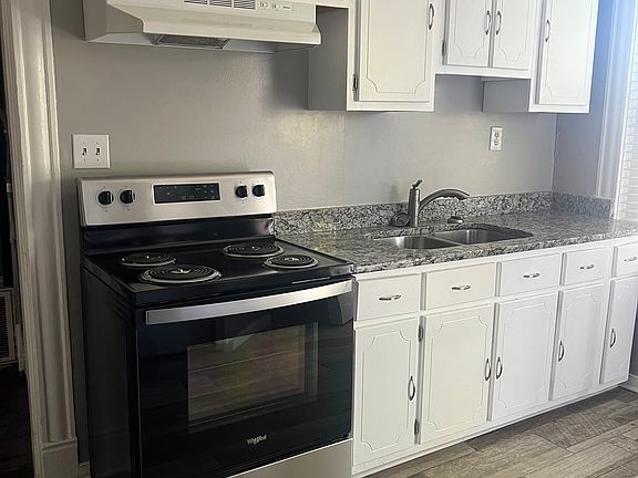 Kitchen with ceramic tile and stainless steel appliances