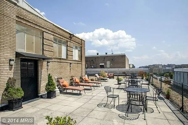 Rooftop - lounge chairs, tables, bbq grill, and more.