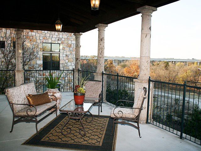 The covered terrace is perfect for lounging or al-fresco dining.