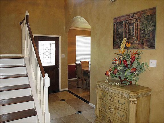 Charming entry welcomes you home and flows into open family room