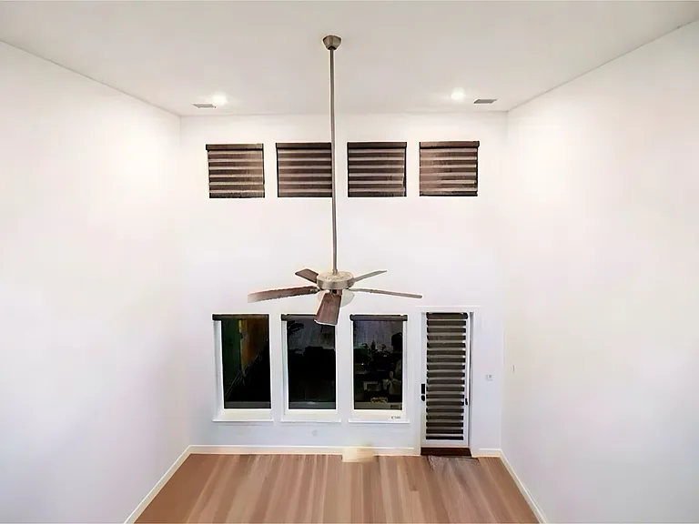 Detailed view of a ceiling fan, wood finished floors, and recessed lighting in Living Area