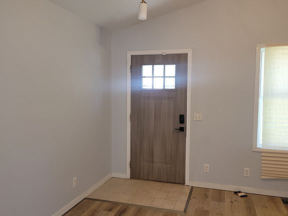 Completely Remodeled front room with tall ceilings