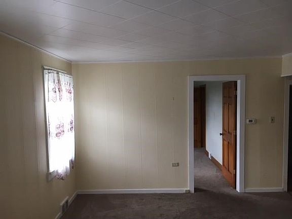 Living room has new carpeting.