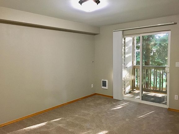 Second bedroom/den with double door entry and glass slider t