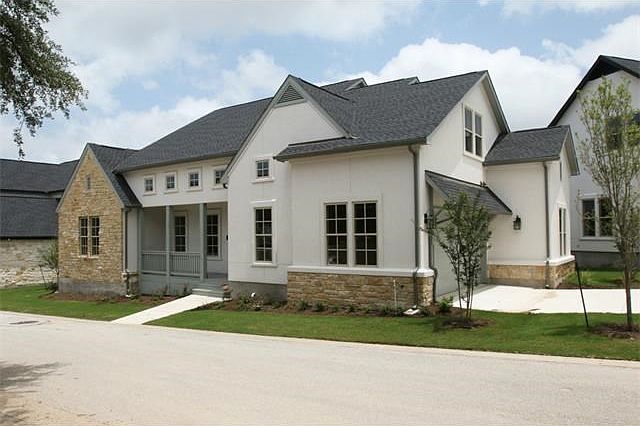 A Lovely exterior that  features stone and stucco.