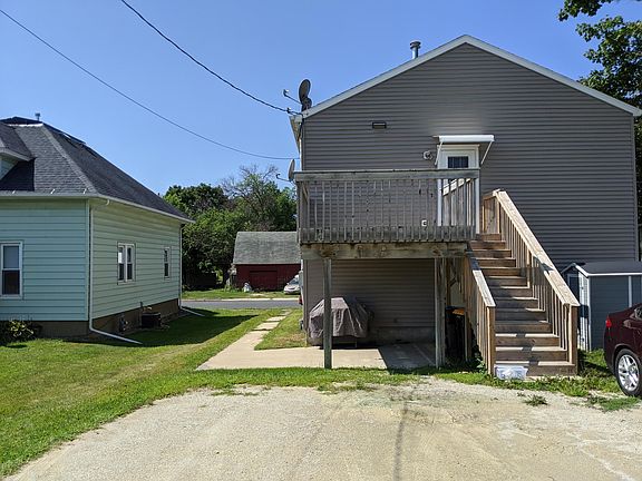 Back of duplex. Entrance to upper unit up the stairs.