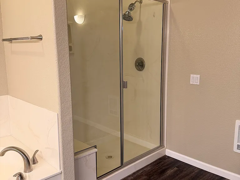 Master bathroom; large walk-in shower with seat