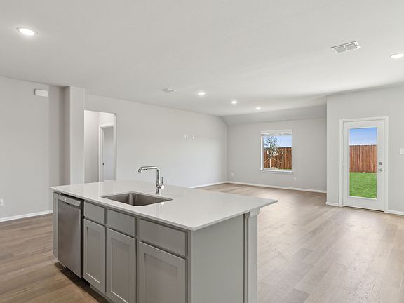 Kitchen in the Harrison home plan by Trophy Signature Homes - REPRESENTATIVE PHOTO