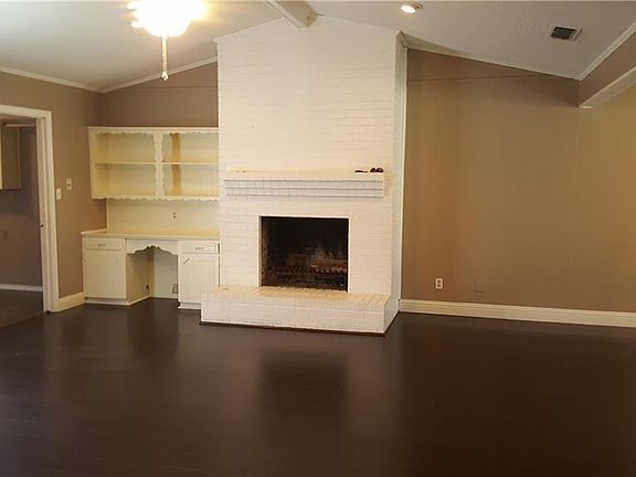 Living Room with Ceiling Fan and Gas start fireplace