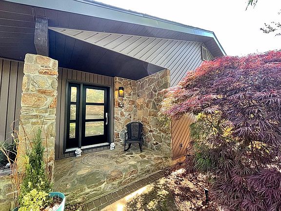 Stone porch and modern entry