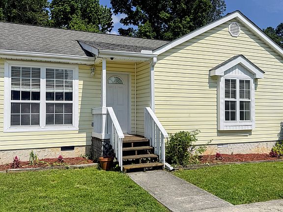 Front door entrance. Master bedroom are the double windows to the right.