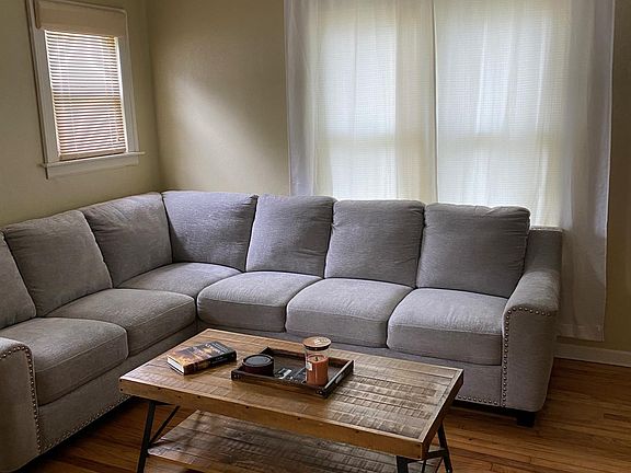 Living rwith hardwood floors that were refinished 3 years ago.