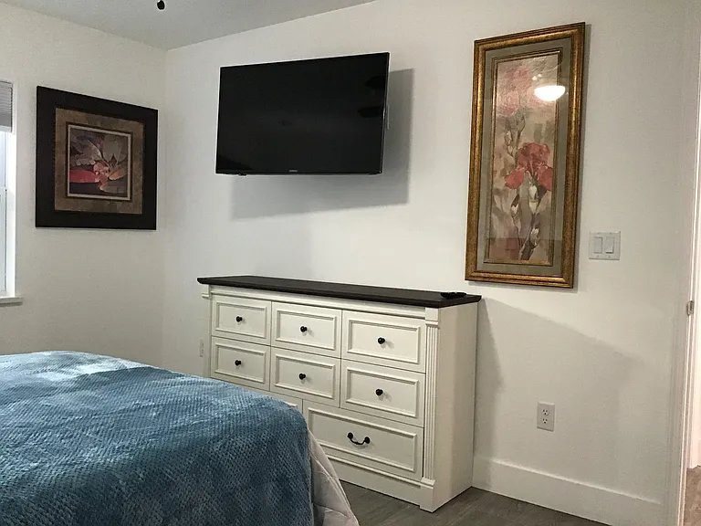 Relaxing retreat with tasteful furnishings, Smart TV entertainment, and generous space for extended stays.