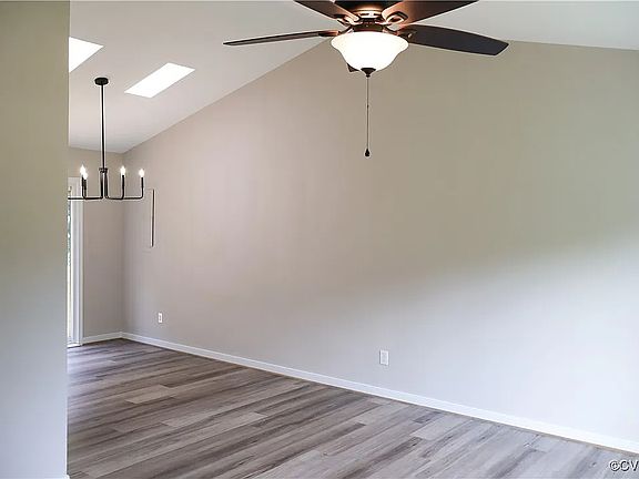 Living room open into dining area and kitchen