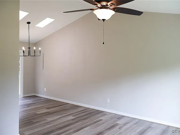 Living room open into dining area and kitchen