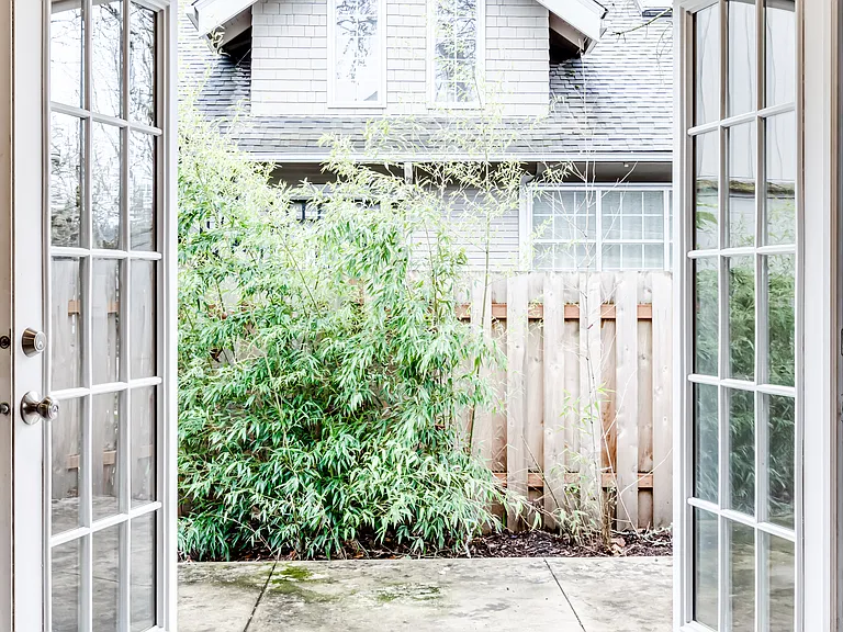 French doors in the livingroom/kitchen lead to a private patio perfect for summer dinner parties.