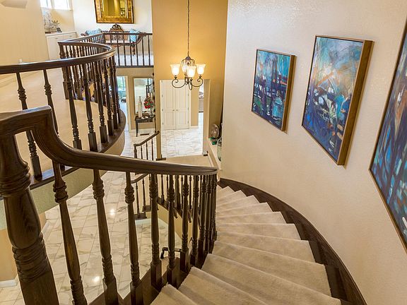 Dramatic cascading staircase w/designer artwork