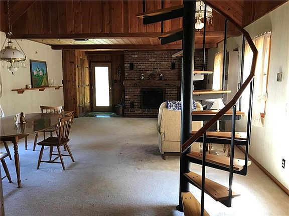 Family room with Spiral Staircase to Loft