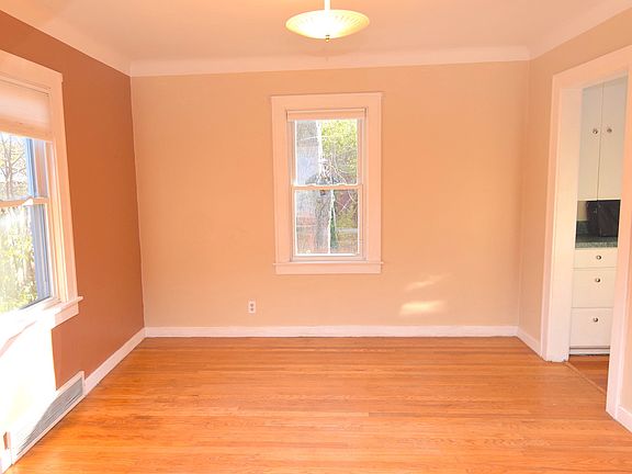 Large dining room with hardwood floors.