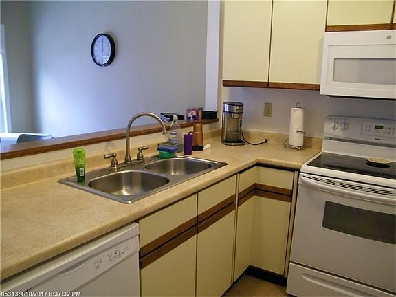Updated kitchen with new sink, countertop, appliances.