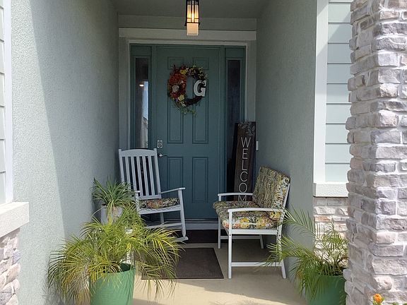 "Welcoming covered entry with clean, modern design"