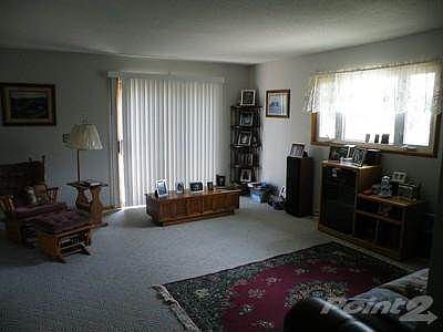 Living room with patio door to deck