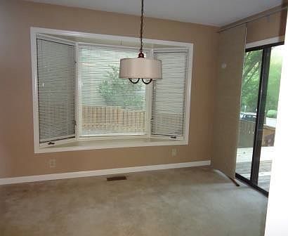 large dining with entrance to deck