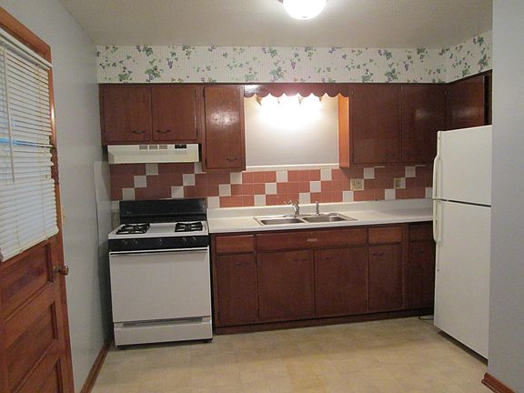 ROOMY KITCHEN WITH DINING AREA AT THE OTHER END