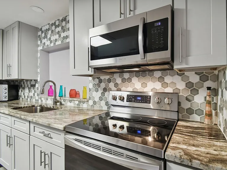 Totally updated kitchen with granite counter tops, stainless steel appliances and plenty of custom cabinets.