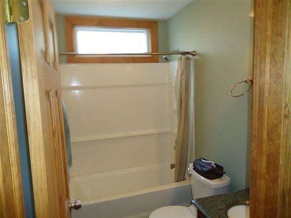 Bath with tub surround shower, granite vanity top