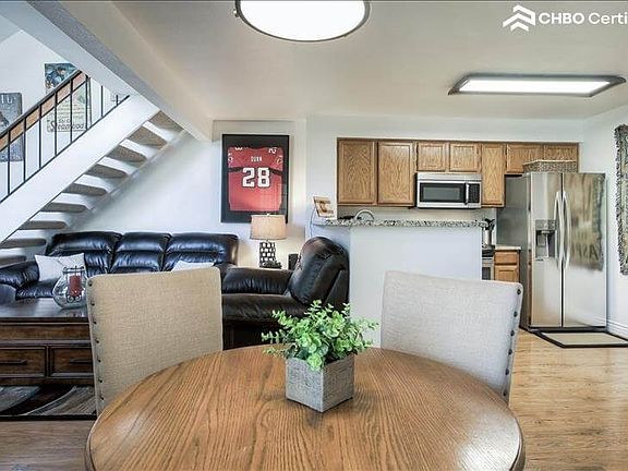 Dining table with Kitchen on left and living