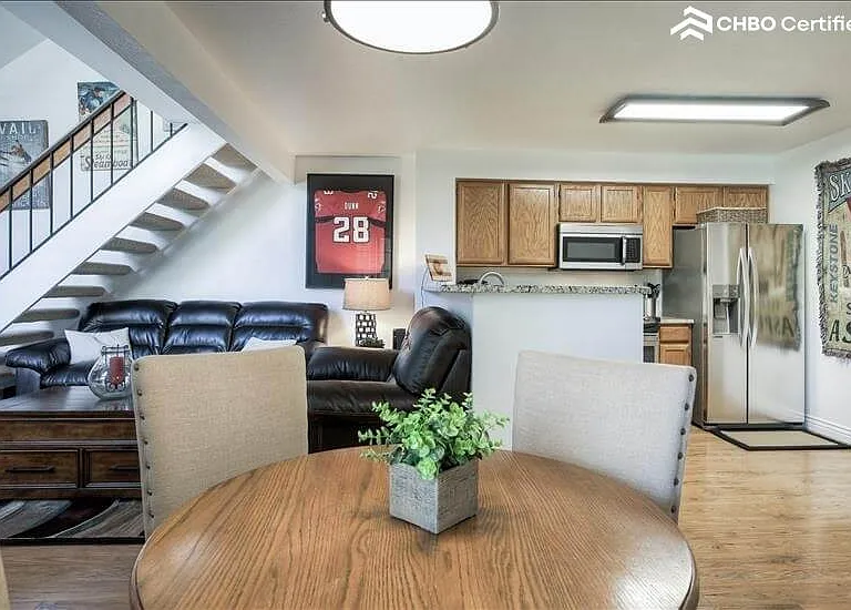 Dining table with Kitchen on left and living