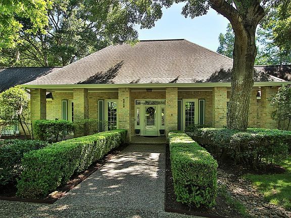 This extended covered patio with elegant storm door surrounded by lovely sidelights welcomes you in!