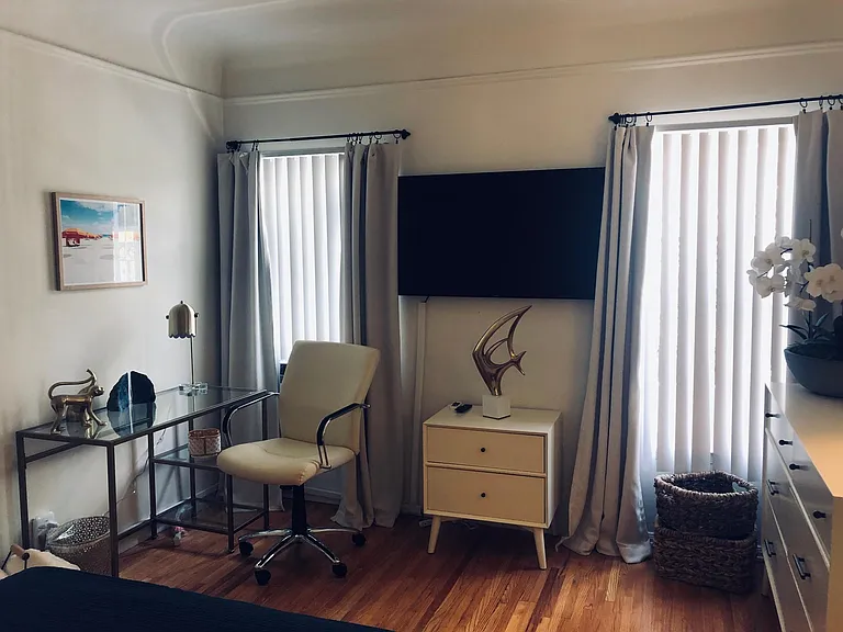 Bright large bedroom with workspace