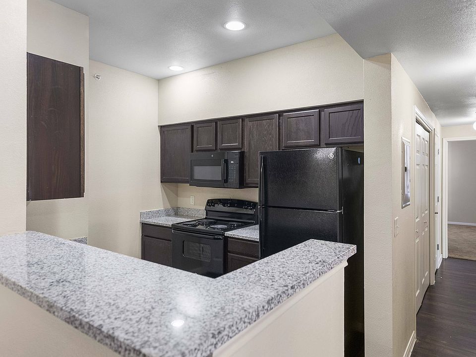 Stylish Kitchen with Granite Countertops and Modern Appliances