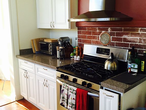 Kitchen - spacious and with a pantry off to the right - sun/dining room to the left - open to living room