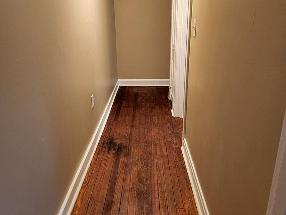 Refinished pine hardwood flooring.