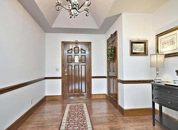 Entry foyer with coffered ceiling.