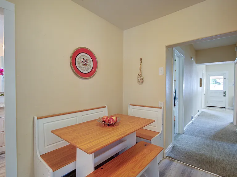 KITCHEN EATING NOOK... bathroom to left , hallway to front door