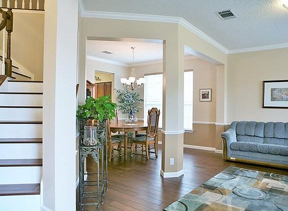 The gorgeous hardwood floors add coziness to the open and airy space.