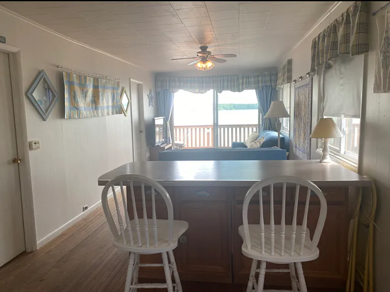 Standing in the kitchen , eat in nook to enjoy your meals with the beautiful view of the lake.