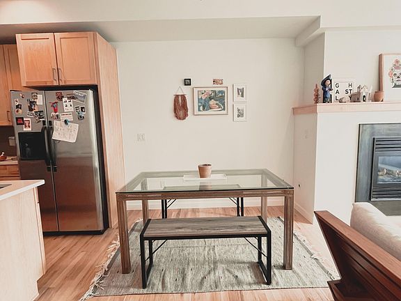 Dining area separating kitchen and living room