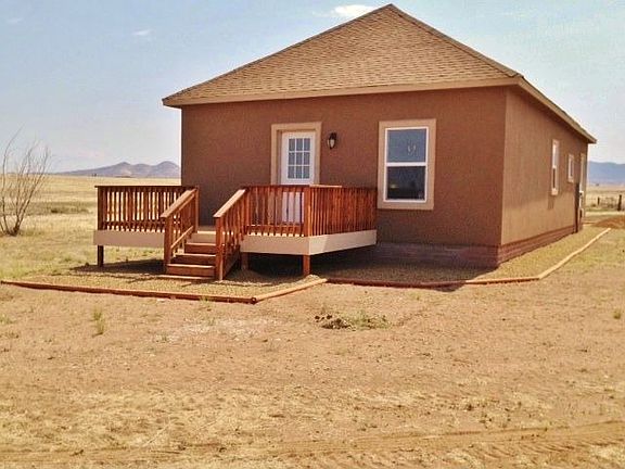 LANDSCAPE ROCK AND DECKED OFF MASTER BEDROOM 